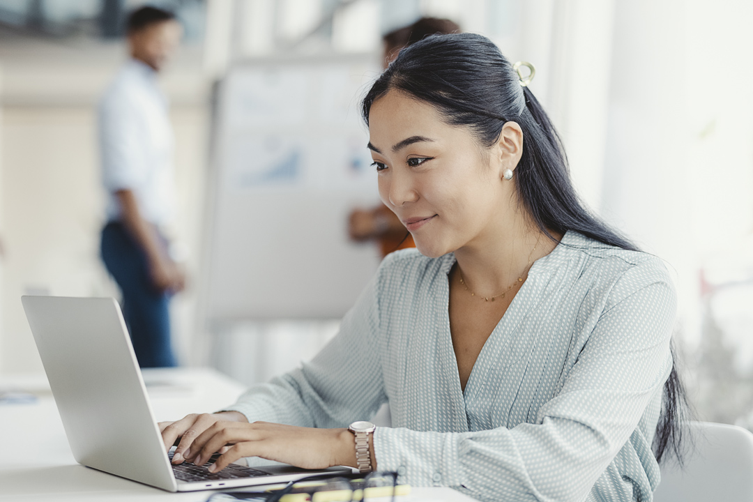 Businesswoman busy working on laptop computer