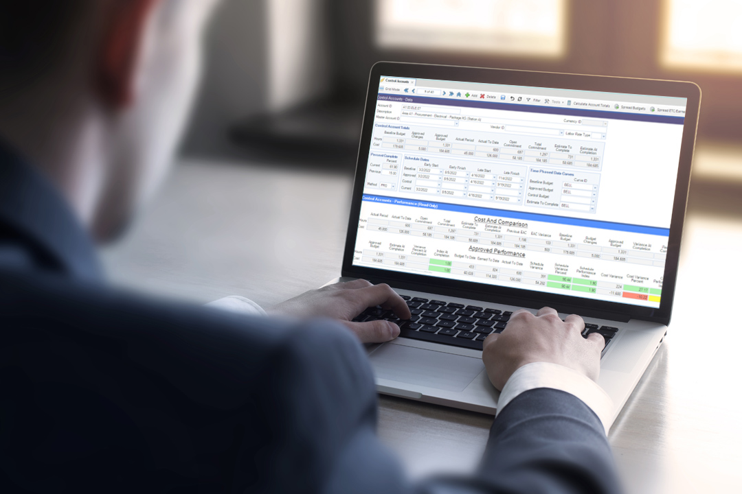 Project management professional analyzing EVM using Contruent Enterprise software.