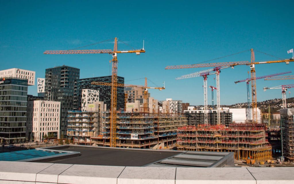 City skyline showing cranes